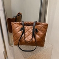 Brown quilted leather tote bag with elegant diamond pattern and black shoulder straps - Brown
