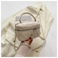 Detail of beige quilted mini box bag with chain strap on an artistic background - White Large