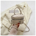 Close-up of cream quilted mini box bag with chain strap and silver flower zipper - White Small