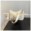 White baguette shoulder bag with small coin purse and golden zipper closure in detail - White