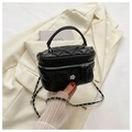 Close-up of black quilted chain vanity bag with silver hardware and floral buckle detail - Black Large