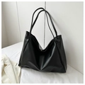 Close-up detail of soft black PU leather tote bag with fine texture and magnetic buckle - Black without Pendant