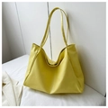 Detail view of large pale yellow tote bag with magnetic closure and smooth synthetic finish - Yellow Without Pendant
