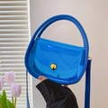 Sac à main bleu en PVC transparent avec fermoir doré et bandoulière amovible - Bleu