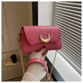 Detail view of pink crocodile pattern texture and crescent moon gold metal buckle - Pink