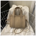 Beige woven straw tote bag with leather trim and adjustable crossbody strap - Khaki