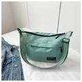 Mint green nylon crossbody sports bag with adjustable strap and layered zipper design - Green