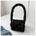 Detail of black quilted nylon bag featuring a puffy rhombus pattern and ruched handle - Black