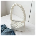 Close-up of white quilted puffy cloud bag with elegant gold zipper and pleated handle - White