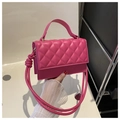 Detail of hot pink quilted handbag with rhombic pattern and stylish knotted rope strap - Rose Red