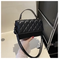 Detail of black quilted leather handbag with gold hardware and removable shoulder strap - Black