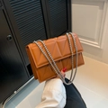 Brown orange crossbody bag with triangle quilted pattern and silver chain strap - Brown