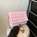 Pink bubble textured crossbody bag featuring stylish pleated flap and gold chain strap - Pink