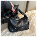 Detail of black leather bag with colorful gemstones and a trendy ruched handle - Black