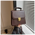 Detail of a dark brown vintage British style crossbody bag with a golden metal buckle - No Pendant / Coffee