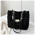 Close-up of black pleated puff tote bag with pearl pendant and silver chain details - Black