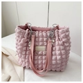 Detail of light pink bubble textured tote bag with pearl and floral charms and chain strap - Pink