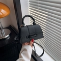 Chic black litchi pattern leather crossbody bag with top handle and drawstring detail - Black