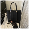 Black vertical striped tote bag with gold metal hardware and long shoulder strap - Black