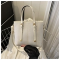Chic off-white vertical striped bucket bag with gold hardware and shoulder strap - White