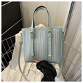 Light blue bucket tote bag with vertical woven stripes and matching shoulder strap - Blue