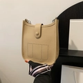 Beige lychee pattern bucket bag with striped woven strap and perforated detail - Khaki