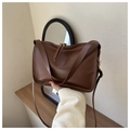 Detail of dark brown matte tote bag with dual zippers and adjustable shoulder strap - Brown