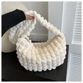 Detailed view of the ivory pleated bubble textured shoulder bag with golden zipper closure - No Pendant / White