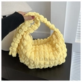 Detailed view of yellow popcorn textured fabric on a stylish crescent shoulder bag - No Pendant / Yellow