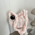 Striped bubble textured tote bag with cute soot sprite plush charm on a reflective surface - Pink (with Pendant)