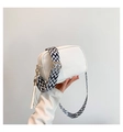 White lychee leather crossbody bag with geometric woven strap and tassel detail - White