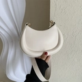 Minimalist beige crescent shoulder bag with puffy texture and gold ring hardware - White