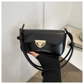 Detail of a black glossy crossbody bag featuring a striking gold triangle metal lock - Black