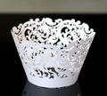 Intricate laser-cut white lace cupcake wrapper with Baroque hollow pattern on black surface - White