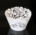 Macro detail of white laser-cut cupcake wrappers with elegant vine patterns - 5cm / White