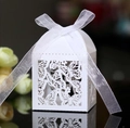 Detailed laser-cut butterfly gift box with white organza ribbon on reflective surface - White