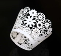 Detailed close-up of laser-cut white daisy lace cupcake wrappers for wedding decor - 5cm / White