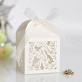 Detail of white laser-cut butterfly candy box with elegant chiffon ribbon bow decor - Ivory
