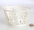 Detail of laser-cut cupcake wrapper featuring delicate white deer and snowflake patterns - 5cm / Ivory