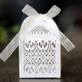 Laser cut white wedding candy gift box with intricate floral pattern and white silk ribbon - White