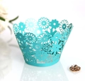 Detail of light blue laser-cut cupcake wrappers with elegant hollow flower pattern decor - 5cm / Tiffany Blue
