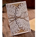 Laser cut hollow wedding invitation cover with kraft paper and hemp rope on wood surface - White