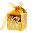 Macro detail of laser-cut butterfly wedding candy box in golden metallic finish - Reflective Gold