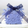 Detailed snowflake hollow candy box with dark blue organza ribbon and cutout patterns - Sapphire Blue