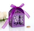Detail view of purple laser-cut lace candy box with elegant star pattern and ribbon bow - Dark Purple