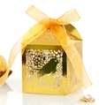 Gold laser-cut gift box with love bird patterns and a yellow silk ribbon bow on white background - Reflective Gold