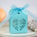 Detail of light blue laser-cut candy box with heart leaf pattern and organza bow - Tiffany Blue
