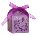 Detail of purple laser-cut candy box featuring intricate floral and bird patterns with bow - Deep purple