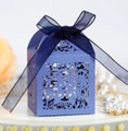 Close-up of dark blue wedding favor box with laser-cut Xi character and organza ribbon - Royal Blue