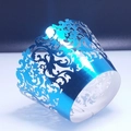 Intricate laser-cut blue lace cupcake wrapper with decorative European scroll patterns - Reflective Blue